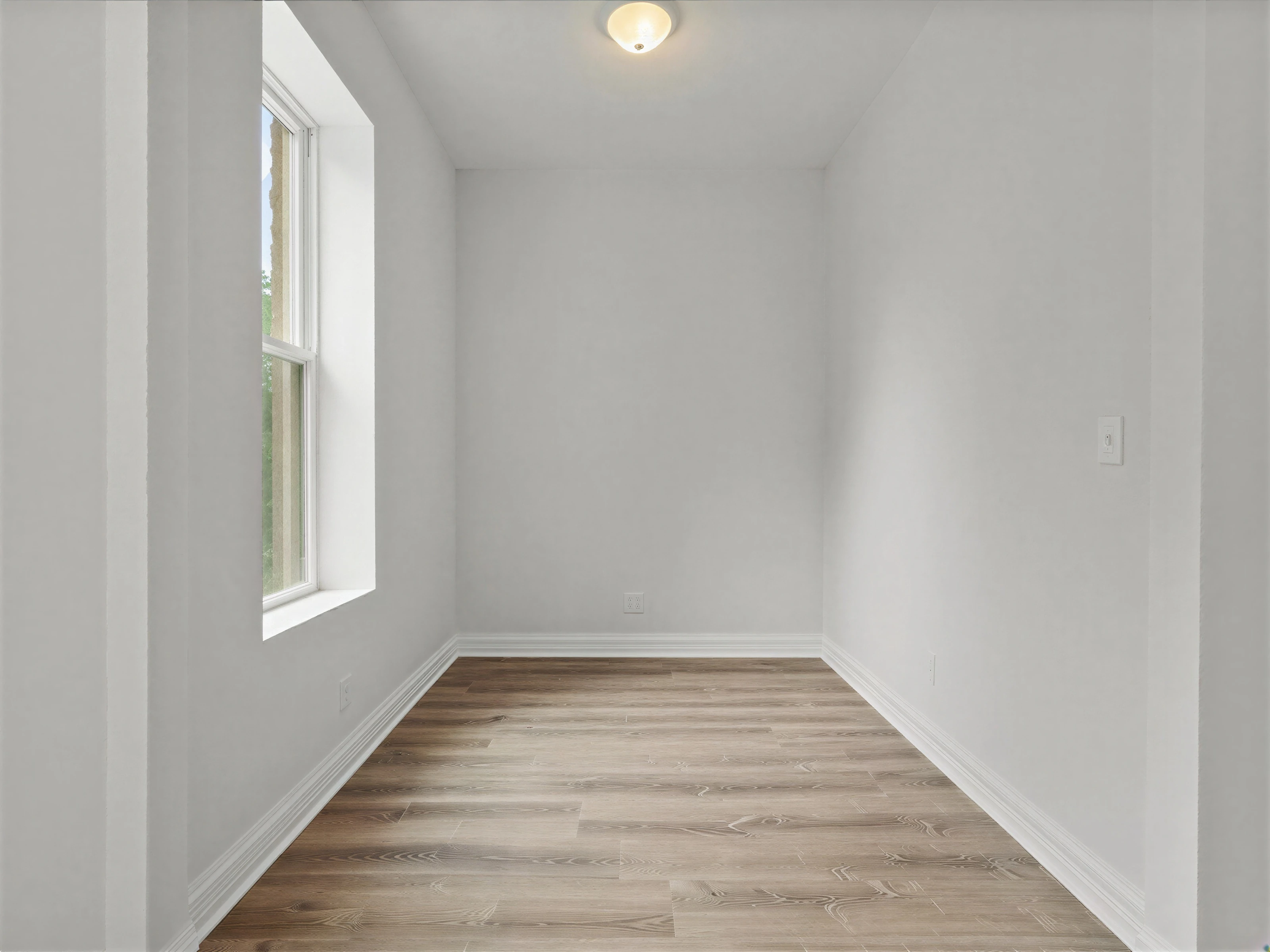 Renovated bedroom with recessed lighting