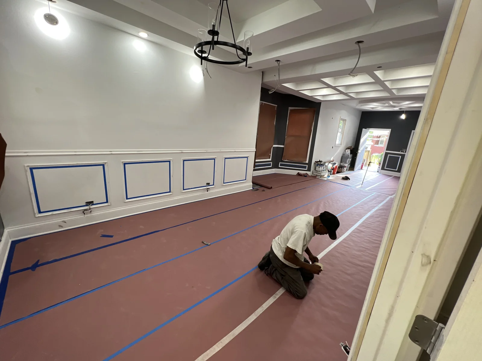 Crew mid-renovation with walls open during a gut rehab