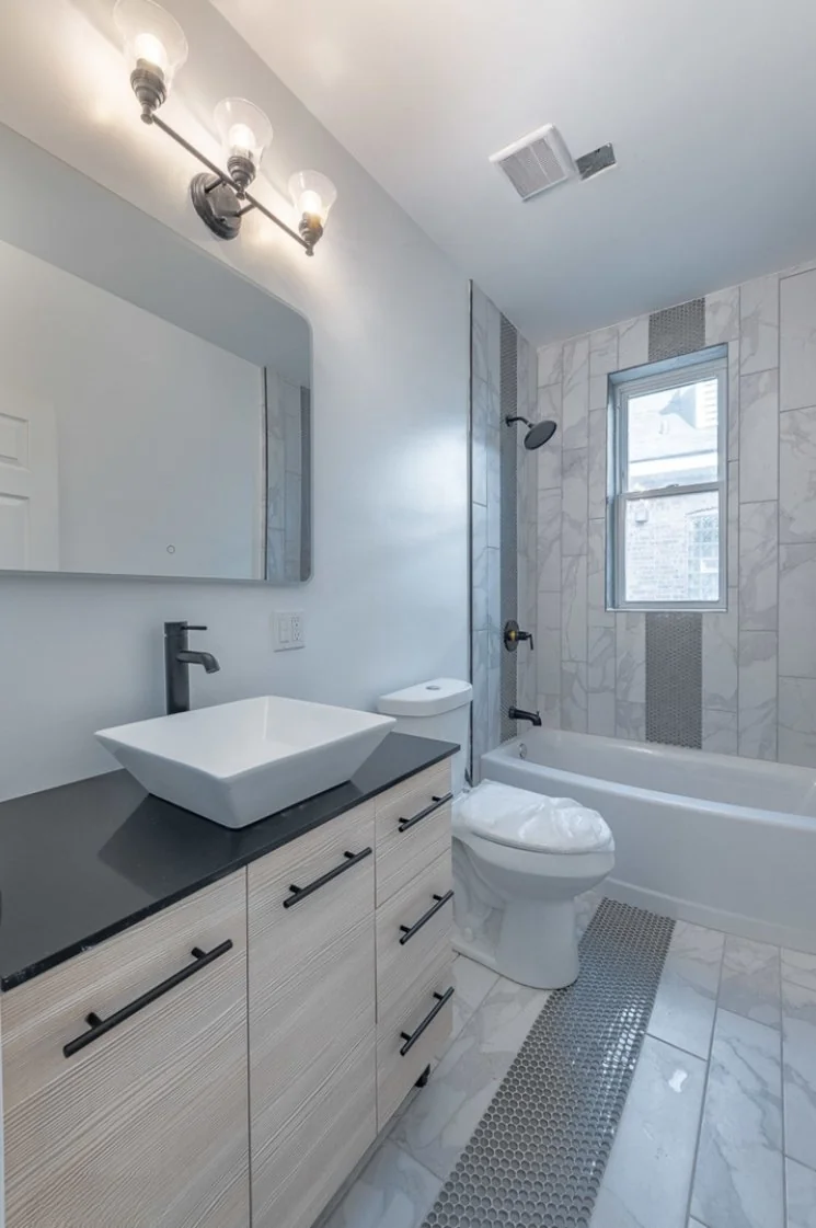 Bathroom with a soaking tub and vanity