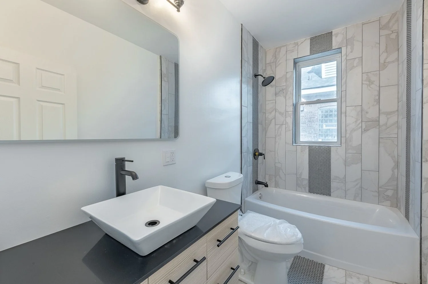 Full bathroom with a soaking tub