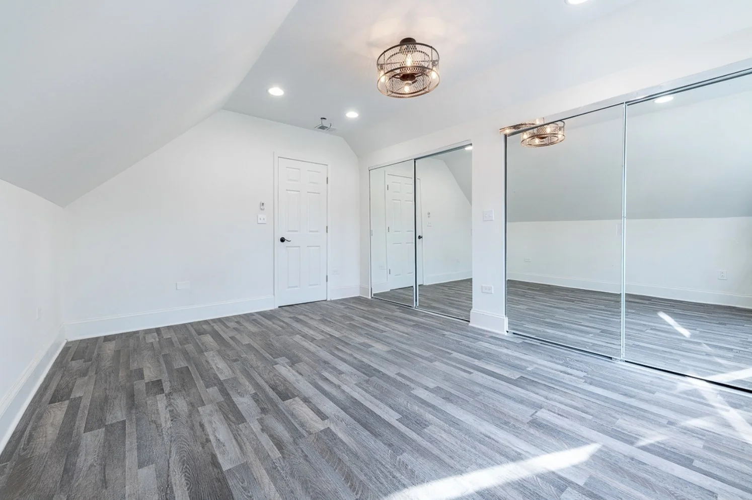 Bedroom with mirrored closet doors