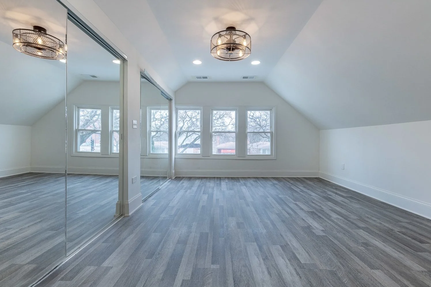 Bedroom with a vaulted ceiling