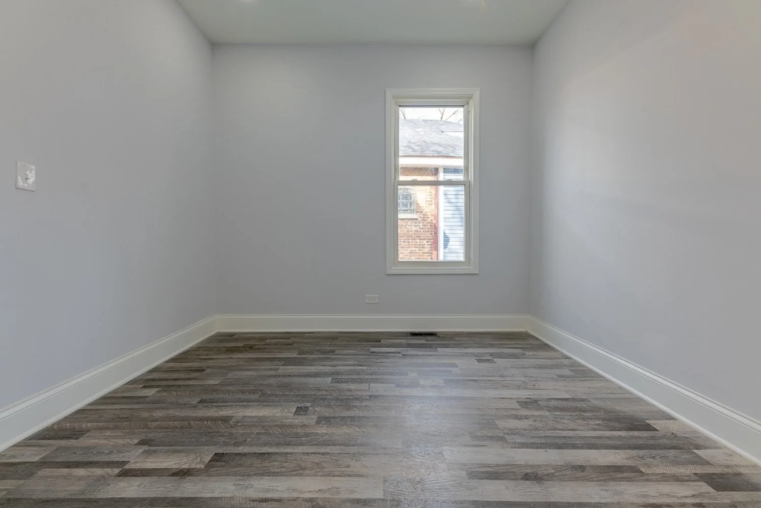 Bright bedroom in a full gut rehab