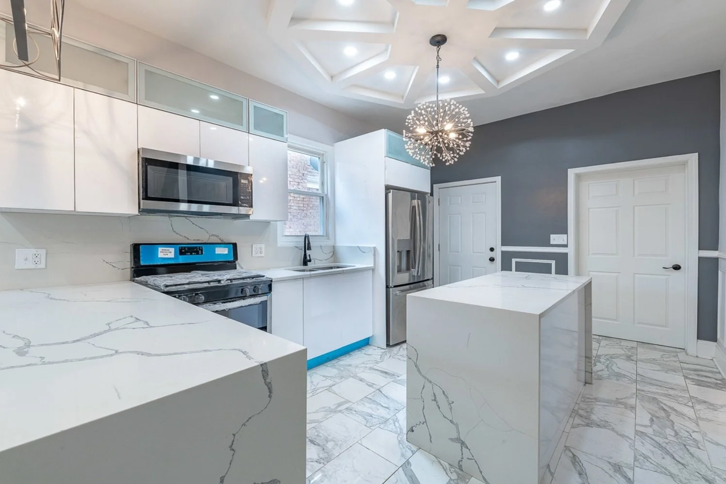 Custom kitchen with quartz island from a Chicago full gut rehab