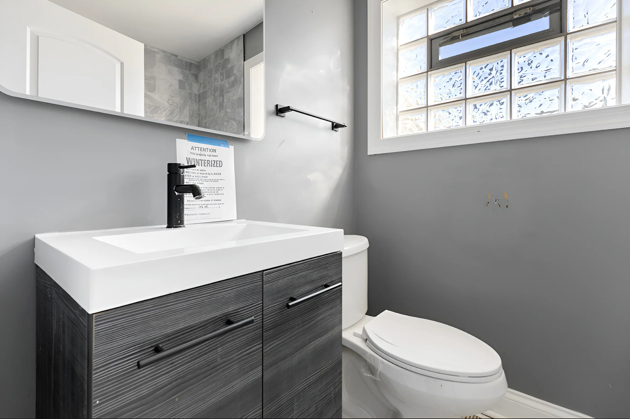 Modern bathroom vanity with black hardware