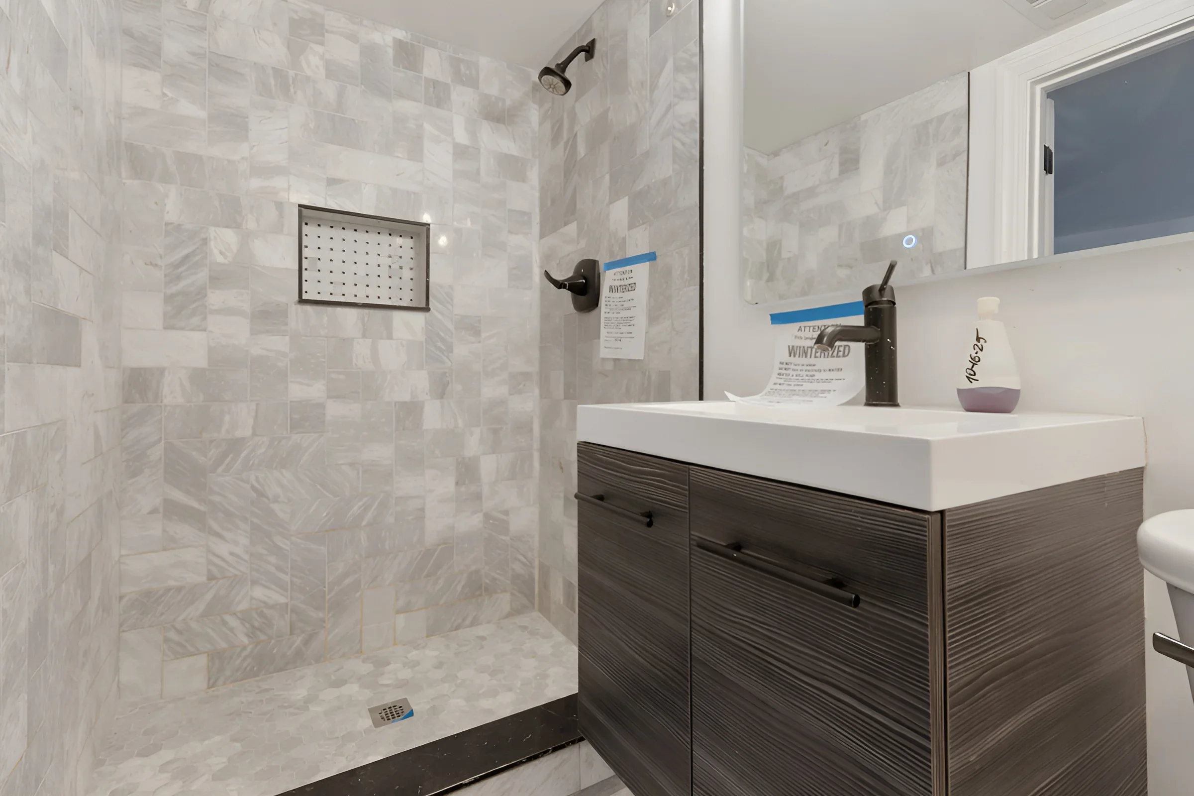 Walk-in shower in the Fuller Park gut rehab