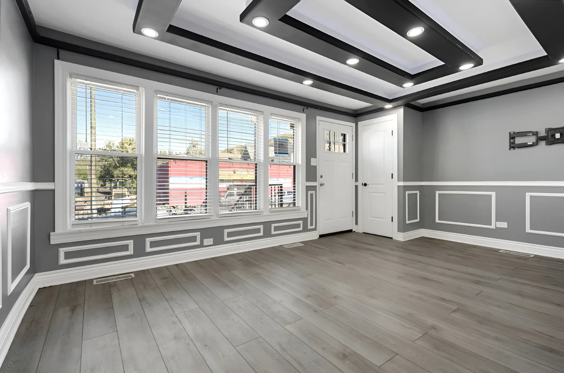 Front living room with wide-plank flooring