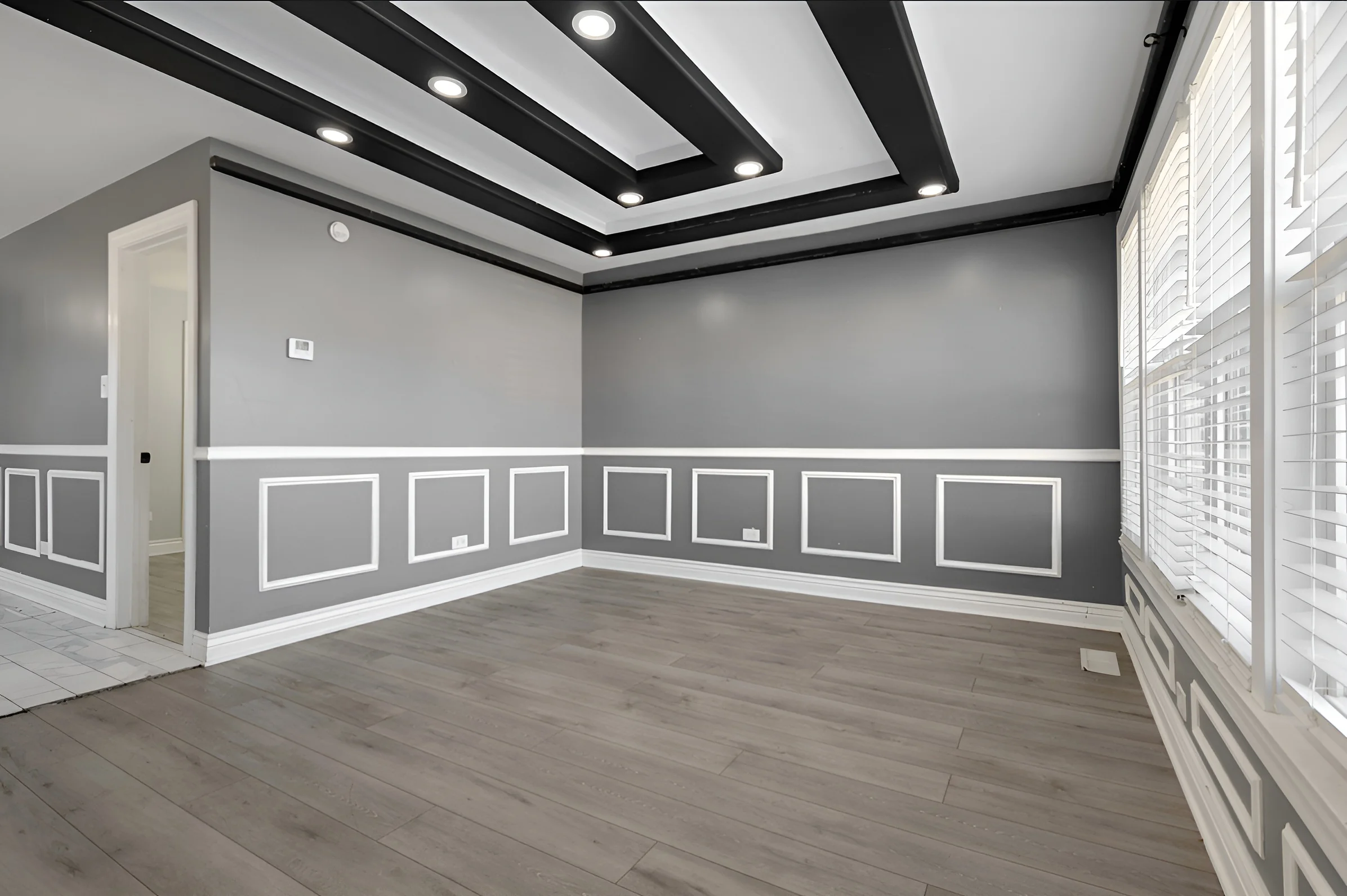 Living room with a tray ceiling in the Fuller Park gut rehab